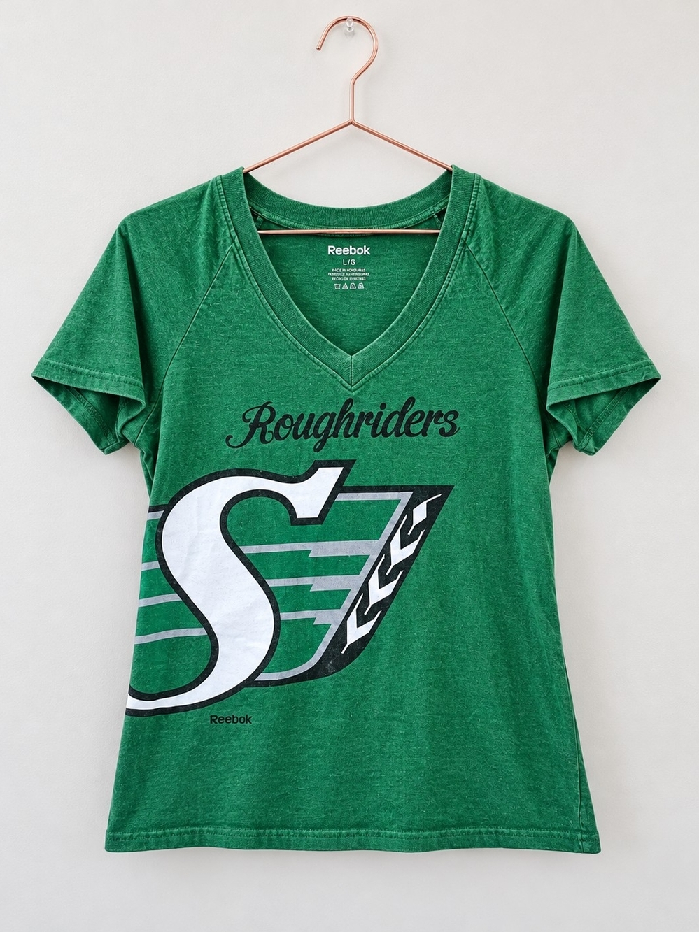 Reebok Womenโs Green Roughriders V-Neck Tee